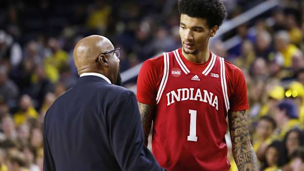 Indiana coach Mike Woodson talks to center Kel'el Ware (1) during the Hoosiers' matchup with Michigan.   